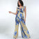products/YELLOWRUFFLESLEEVESURPLICEJUMPSUIT_2.jpg