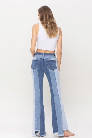 High Rise Relaxed Flare Jeans With Uneven Raw Hem