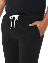 Elastic waist, two side pockets and cinched cuffs.